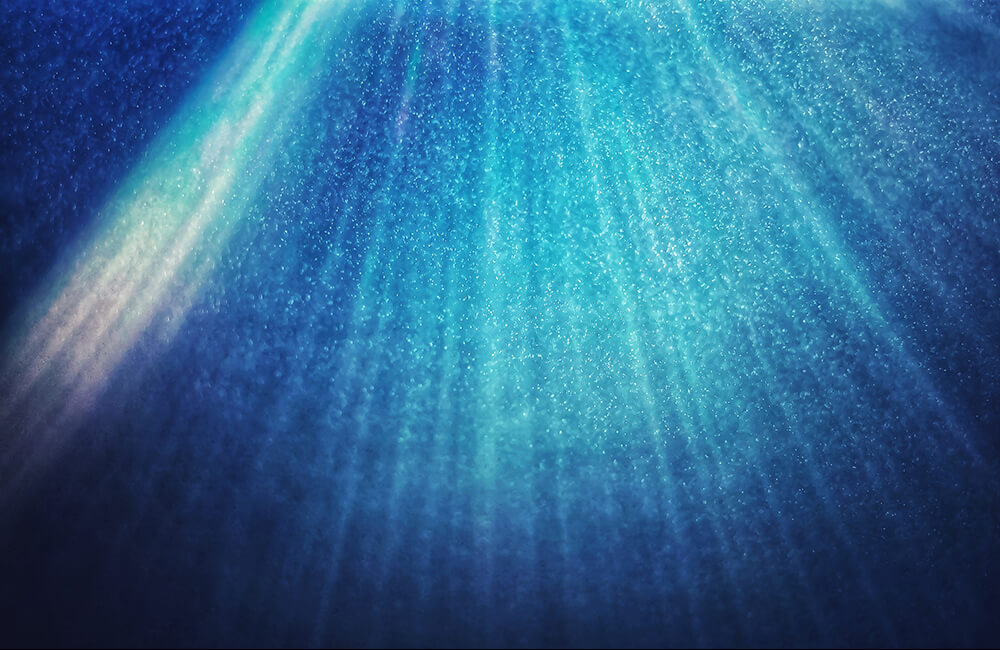 image of water mist in a shower with sunrays coming through
