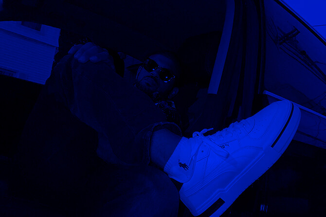 J. White chilling in an Audi Q5